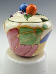 Clarice Cliff PASTEL MELON pattern, shape 230 jampot and matched cover, 8cm, circa 1932.