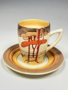 Clarice Cliff - Coral Firs - A Lynton shape coffee can and saucer. Art Deco circa 1933.