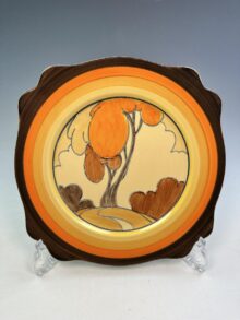 Clarice Cliff Autumn (Orange) pattern Leda shape plate, large size, circa 1932, 24.5cm.
