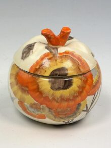 Clarice Cliff RHODANTHE pattern, apple shape jampot and cover, 9cm, circa 1934.