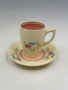 Clarice Cliff BON JOUR (pink) pattern, Lynton (ribbed) coffee cup, 7.5cm, circa 1935.