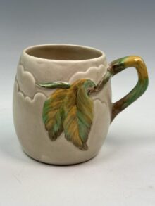 Clarice Cliff CHESTNUT pattern mug with matching handle, 10cm, circa 1937.