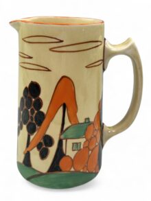 Clarice Cliff TREES & HOUSE (orange) tankard shape water jug, 14.8cm. Circa 1931.