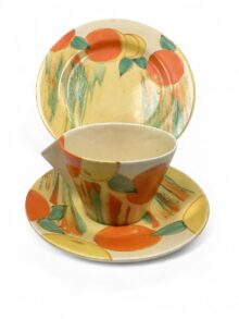 Clarice Cliff DELECIA PEACHES/CITRUS conical trio (cup, saucer & plate), circa 1932.