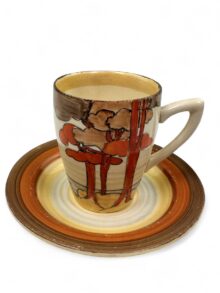 Clarice Cliff - Coral Firs - A Lynton shape coffee can and saucer. Art Deco circa 1933.