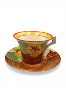 Clarice Cliff NASTURTIUM pattern daffodil shape tea cup & saucer. Circa 1932.