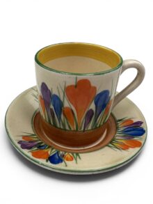 Clarice Cliff CROCUS demitasse coffee can & saucer. Circa 1932. Slight A/F.